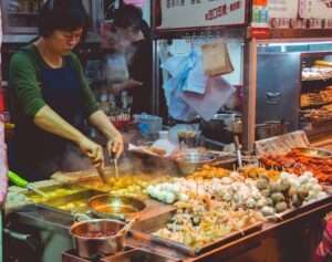 Vibrant street food market with vendors and colorful dishes – street food culture
